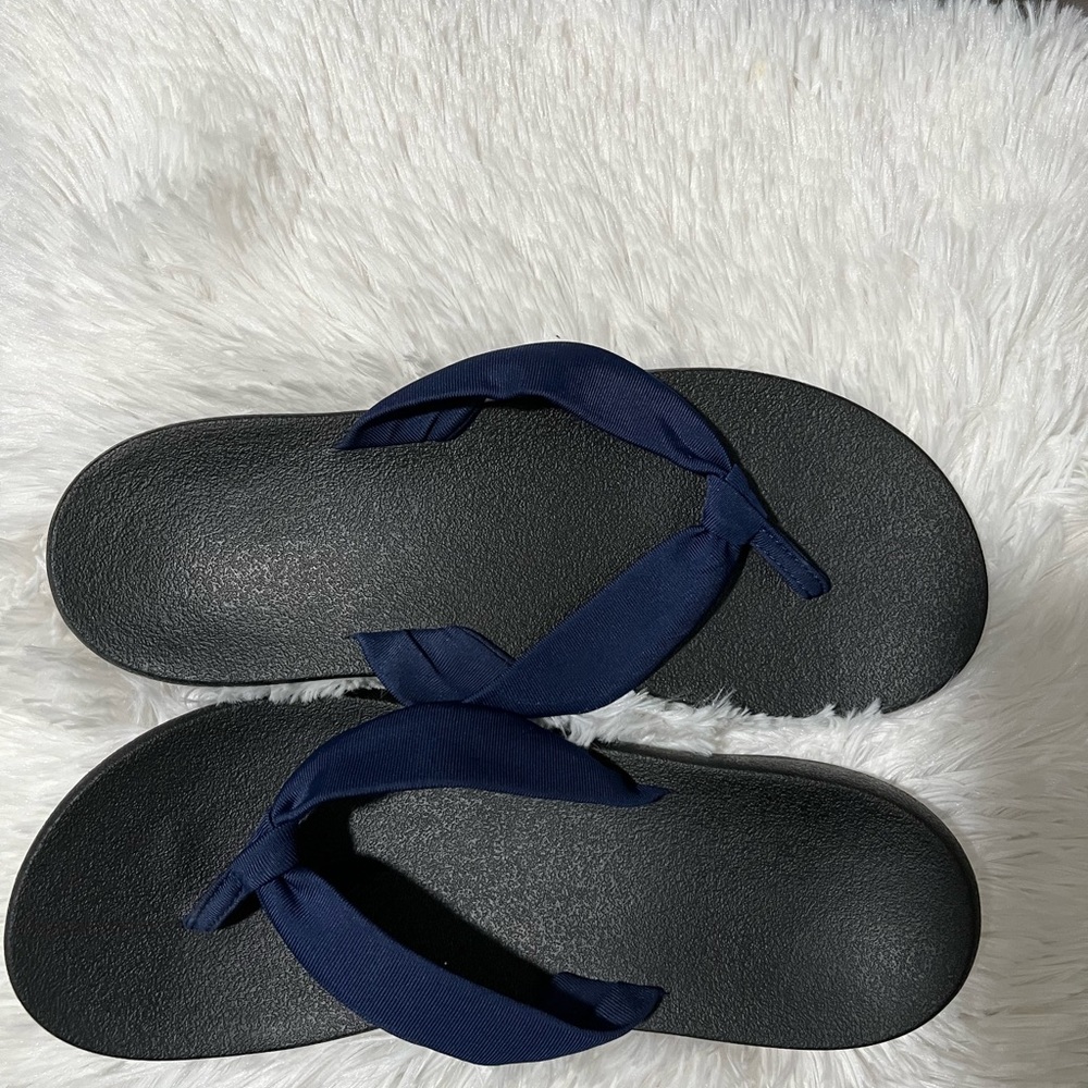 Navy blue flip flops size 9 like new.